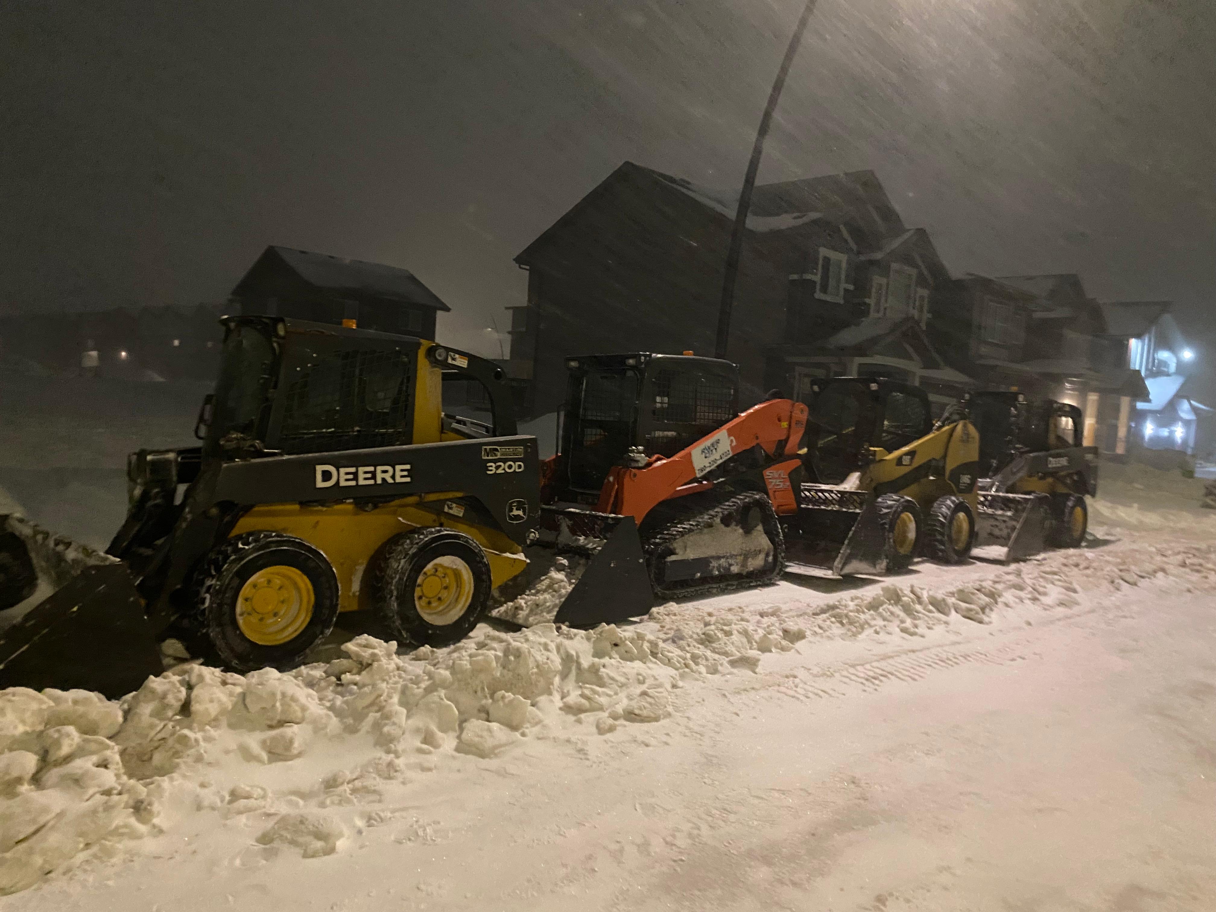 ALA Landscaping snow removal fleet - three machines deployed at night in Edmonton